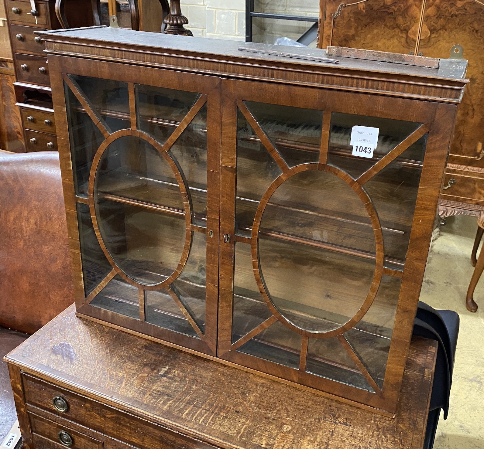 A George III glazed mahogany wall cabinet, width 75cm, depth 19cm, height 63cm